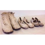 3 pairs of Victorian childs white leather shoes & boots in different sizes. Vender advises a