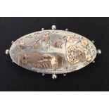 Hallmarked silver antique sweetheart brooch with rose gold highlights. Features clasped hands for