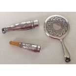 An engraved vintage silver cheroot holder with amber mouthpiece in a matching silver holder,