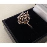 Ladies silver ring with a twisted link design, weight approx 3.3g, size O