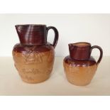 2 stoneware jugs, unmarked possibly Doulton.
