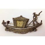 A silver marcasite ladies watch/brooch in the shape of a Venetian gondola set with 2 small garnets