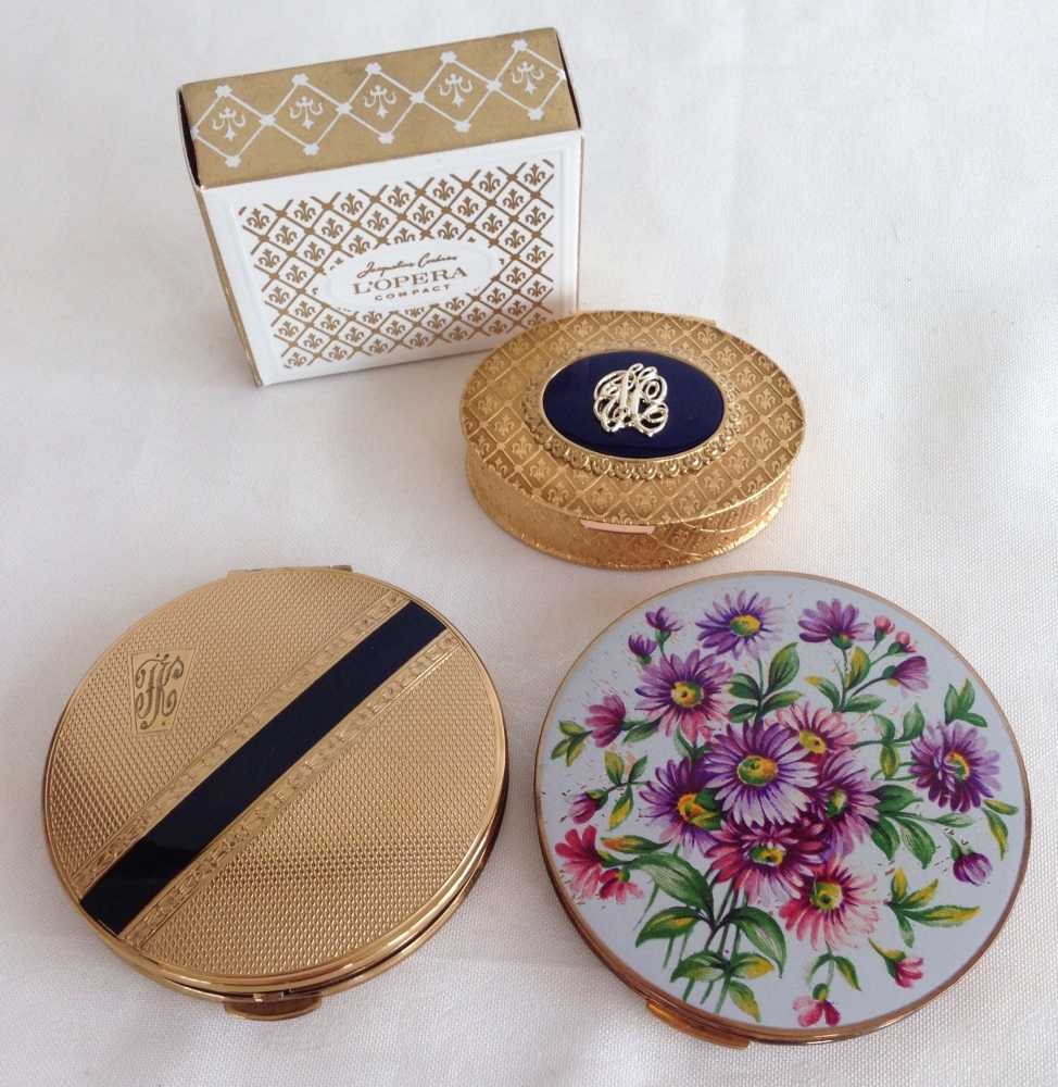 3 ladies vintage powder compacts: 1) Stratton floral pattern, 2) Kigu gold/black stripe and 3)