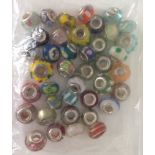 A bag of approx 40 murano glass beads with silver cores.
