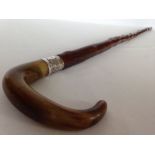 A vintage horn handled walking stick with HM silver collar.