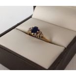 Hallmarked 9ct gold ladies ring set with sapphire and diamonds. Size K, weight approx 1.9g