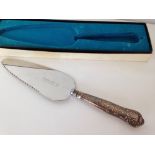 A boxed cake/pie knife with HM silver handle.