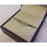 A 9ct gold 1/2 eternity ring set with 9 diamonds, size Q.