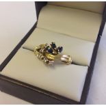 An 18ct gold sapphire & diamond dress ring. Size P 1/2.