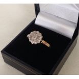 A ladies 9ct gold diamond cluster dress ring, total diamond weight 0.05ct. Size R