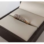 Pretty hallmarked 9ct gold ladies ring set with 16 diamonds - total carat weight 0.20ct. Size O,