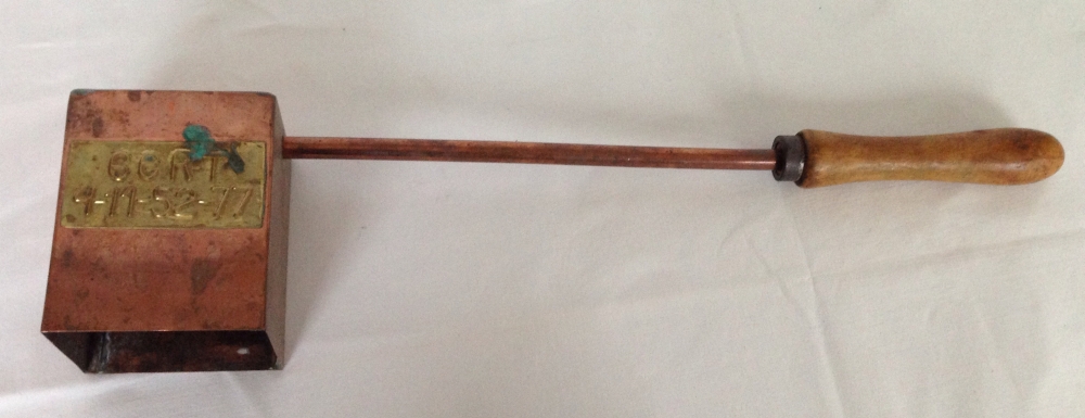 A long handled brass implement possibly railway.