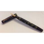 Stephens #106 fountain pen with green marble effect case and 14k gold nib. C.1940's. New sac.