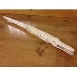 A late 19th/early 20th century carved ivory crocodile. Length 70cm.