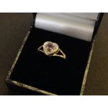 Ladies hallmarked 9ct gold dress ring with an amethyst and small diamond set in a heart shaped mount