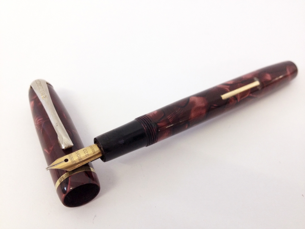 Burnham B49 Fountain Pen c1950s.Pink and Black pearlescent marble with rolled gold trim. A lever