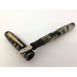 Unique ‘The Unique Pen’ c1950s.Green and black marble with rolled gold trim. Stepped pocket clip,