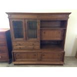 A heavy oak veneered wall unit with 2 glazed doors, 160cm x 162cm