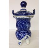 A large oriental blue & white 3 footed lidded urn. 44cm tall.