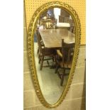 A large gilt framed teardrop/shield shaped mirror. 120cm long.