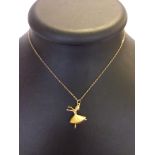 Hallmarked 9ct gold ballerina pendant on gold chain. Weight approx 2g