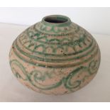 An old oriental pottery bulbous vase with green line decoration. Approx 12cm tall & 14cm diameter.