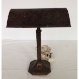 A c1940s metal desk lamp.