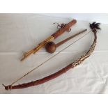 A 20th century African coastal fishing bow, quiver & barbed arrows with a Knobkerrie.