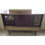 A retro 1963 German Imperial Stromboli 63 stereo radio and VHF TV in polished wood cabinet.