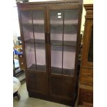 A vintage oak display cabinet.