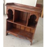 A small vintage oak bookcase.