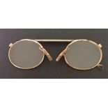 A pair of vintage gold rimmed pince nez, test as 15ct gold.