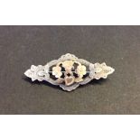 Antique hallmarked silver brooch with rose gold highlights to the central flowers.  Measures 4cm