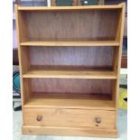 Pine shelves with drawer at base, 121cm tall x 94cm wide.