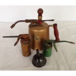 A vintage Musto garden sprayer and 3 oil cans.