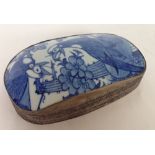 A Chinese blue & white lidded white metal box. Decorated with birds & trees.