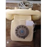 A vintage cream GPO telephone with dial - adapted.