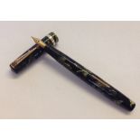 Mabie Todd 'Swan' self filler fountain pen c.1938 with marble effect case and 14k gold nib.