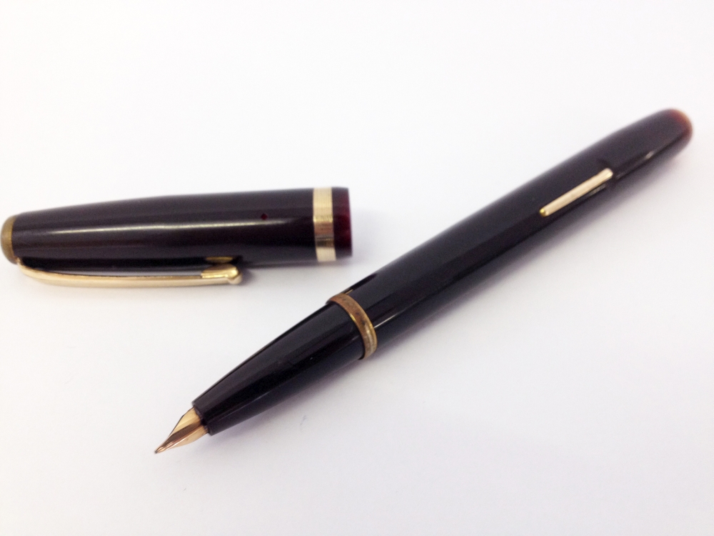 Mentmore ‘Diploma’ Fountain Pen c1950s.Dark brown celluloid with gold filled trim. Grooved gold