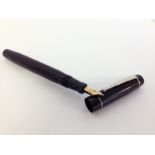 Unique ‘The Unique Pen’ c1950s.Black with chrome trim. A lever filler, ‘Stepped’ pocket clip, cap