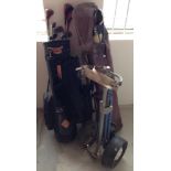 2 sets of golf clubs with trolley.