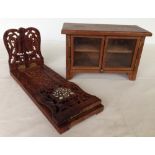 A miniature wooden glass fronted cabinet 17cm tall x 27cm wide with carved sliding bookends.