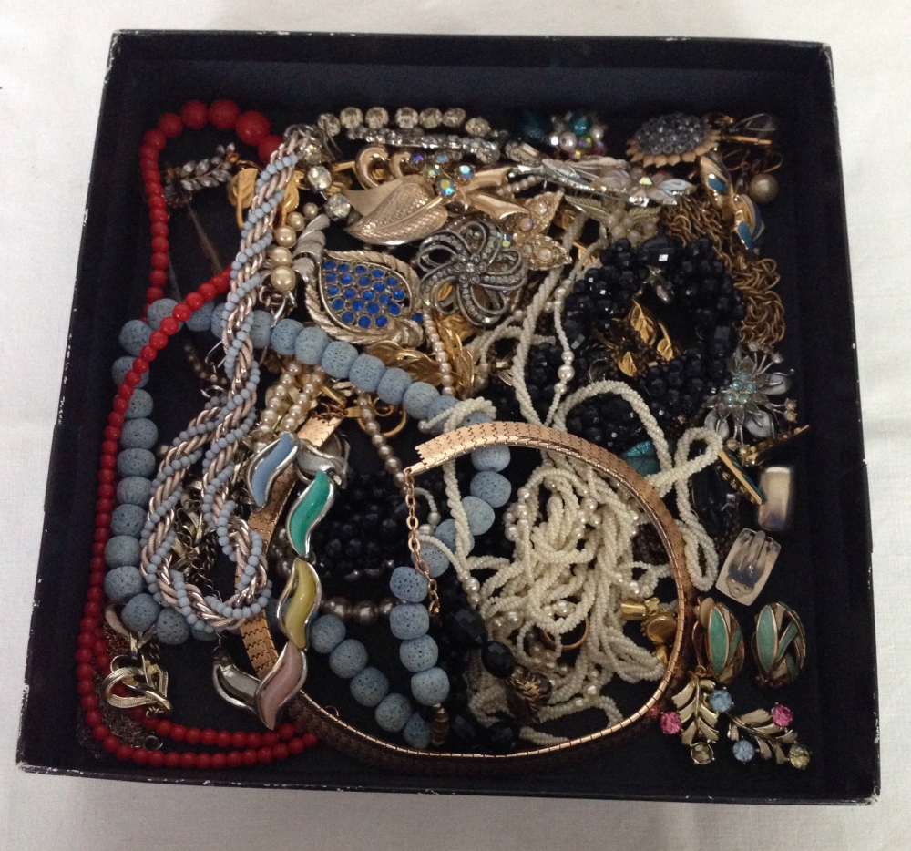 A box of vintage costume jewellery.