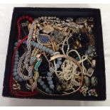 A box of vintage costume jewellery.