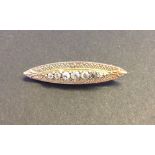 Victorian 9ct gold brooch, Chester hallmark 1896, set with 7 white stones of graduated sizes.