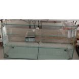 A large custom made table top glass display cabinet.