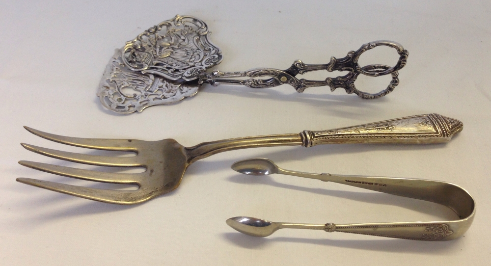 3 silver items to include sugar tongs, silver handled serving fork and asparagus tongs (a/f)