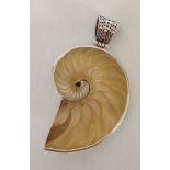 A silver pendant, large ammonite design with mother of pearl. Measures approc 8cm long.