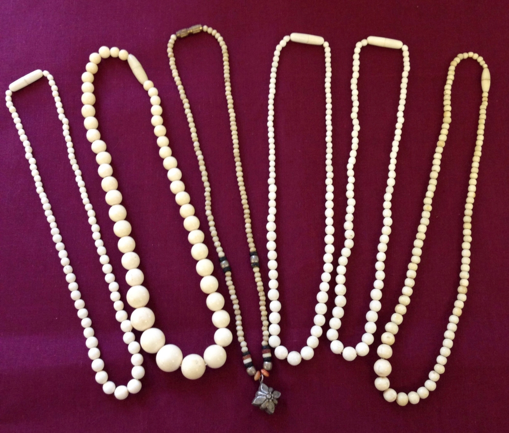 6 vintage necklaces to include bone examples.