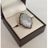 Ladies dress ring set with a large oval moonstone cabouchon, Size approx L½.